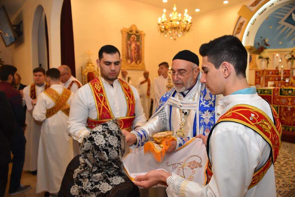 The Eucharist being distributed to the faithful